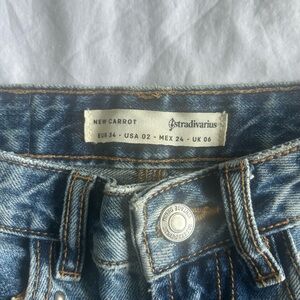 Stradivarius blue denim New Carrot jeans with tan stitching